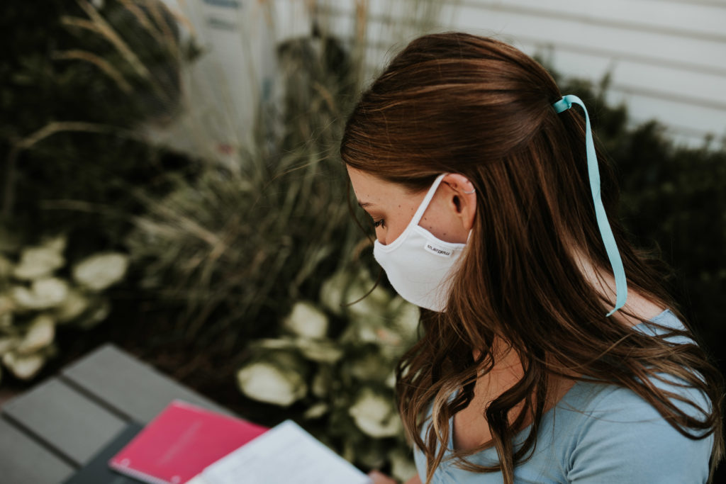 Hengehold reads while wearing a mask.