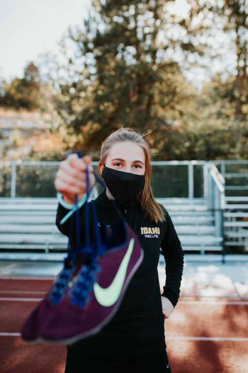 Erica Pecha, both cross country and track athlete, runs on the outdoor track. | Photos by Nataly Davies